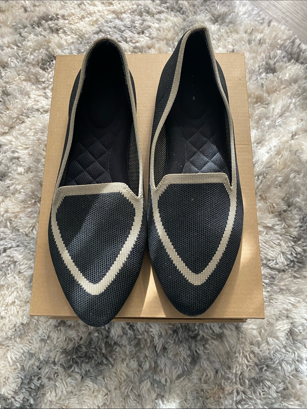 Birdies The Blackbird flat knit loafer shoes in a black and tan.